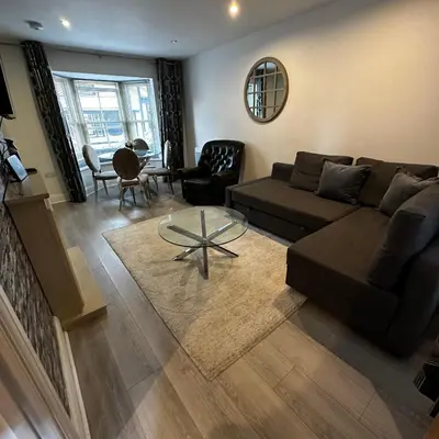 a living room with a couch and a table at One Bedroom Flat Town Centre Colchester in Colchester