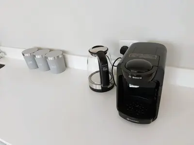 a coffee maker sitting on top of a counter at Modern Town Centre Apartment in Chelmsford