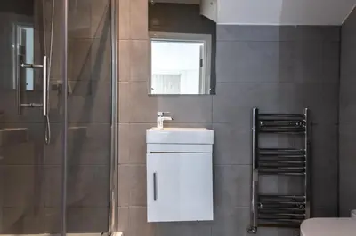 a bathroom with a sink and a shower at Townhouse for Professionals (5 Bedroom 5 Ensuite) in Ipswich