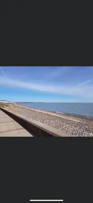 a picture of a beach with the ocean in the background at DaisyChain Getaways The perfect place to Stay Play and Getaway in East Mersea