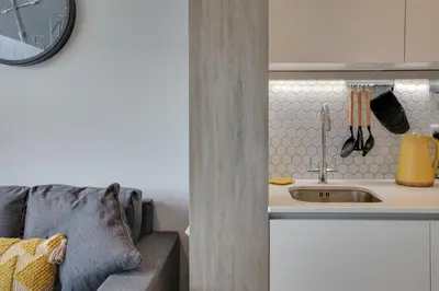 a kitchen with a sink and a counter at Kings Road Apartments in Brentwood