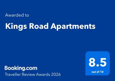 a blue sign that reads kings road apartments at Kings Road Apartments in Brentwood