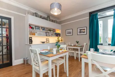 a dining room with a table and chairs at Seaview B&B in Harwich