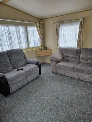 a living room with two couches and a couch at Exquisite holidays letting for 3 nights starting from £90 in Jaywick Sands