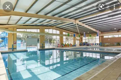 a large swimming pool in a building at Exquisite holidays letting for 3 nights starting from £90 in Jaywick Sands