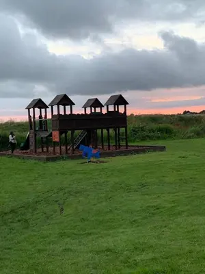 a park with a playground in a field at DaisyChain 2 Getaways - The perfect place to Stay - Play - Getaway in East Mersea