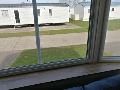 a window with a view of a yard at 709 Seawick in Jaywick Sands