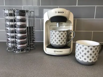 a coffee maker sitting on a counter next to a mug at Stanford Villa in Stanford le Hope