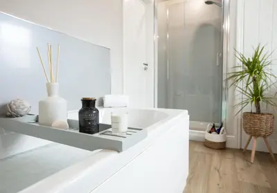 a white bathroom with a sink and a mirror at City to Country Retreat Luxury Cottage with Hot Tub in Toppesfield