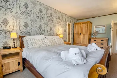 a bedroom with a bed with towels on it at 5 Bed in Bramfield oc-sftmh in Bramfield