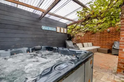 a hot tub in the backyard of a house at 5 Bed in Bramfield oc-sftmh in Bramfield