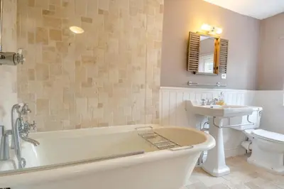 a bathroom with a tub and a sink and a toilet at 5 Bed in Bramfield oc-sftmh in Bramfield