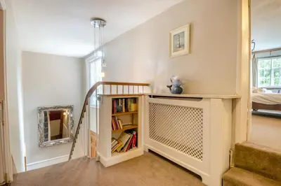 a room with a staircase and a book shelf at 5 Bed in Bramfield oc-sftmh in Bramfield