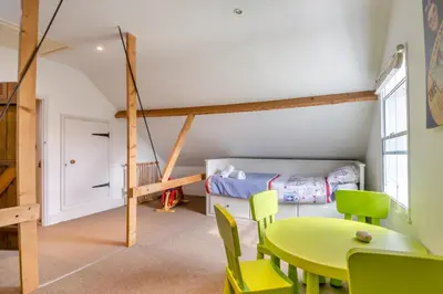 a room with a table and chairs and a bed at 5 Bed in Bramfield oc-sftmh in Bramfield