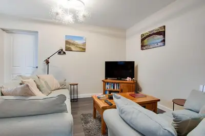 a living room with two couches and a tv at 3 Bed in Great Waldingfield oc-ac2 in Great Waldingfield