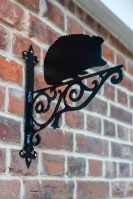 a black object attached to a brick wall at 1 Bed in Great Waldingfield oc-ac1 in Great Waldingfield
