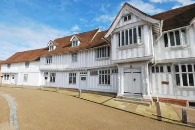 a large white building with a brown roof at 2 Bed in Great Waldingfield oc-ac3 in Great Waldingfield