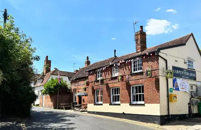 an old brick building on the side of a street at The Tower, 1 bed 1850's Tiny House in Maldon