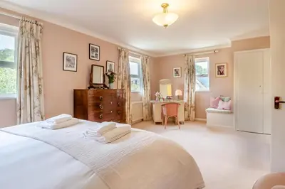 a bedroom with a bed with two towels on it at 3 Bed in Aldeburgh oc-spcot in Aldeburgh