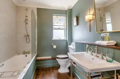 a bathroom with a tub and a toilet and a sink at 3 Bed in Aldeburgh oc-spcot in Aldeburgh