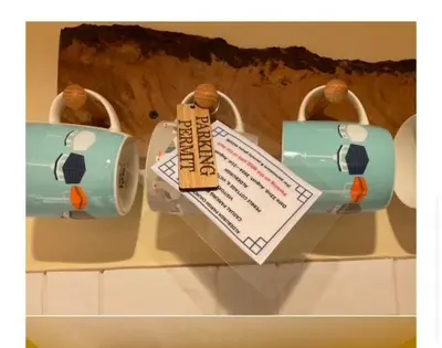 a display of a toy purse on a shelf at Pebble Cottage - 6 Victoria Rd - Aldeburgh Coastal Cottages in Aldeburgh