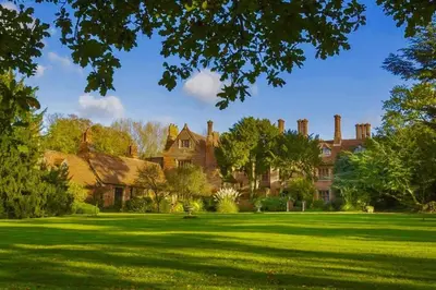 a large house with a green lawn in front of it at Elizabethan Manor House - Sleeps 2-4 - Parking in Burnham on Crouch