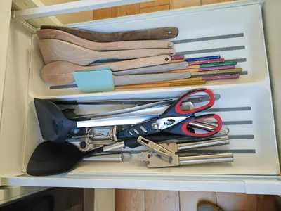 a drawer filled with scissors and other kitchen utensils at Cambridge city centre immaculate 2 bed apartment in Cambridge