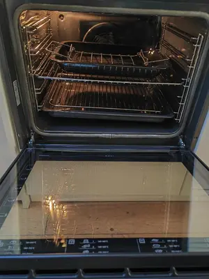 an oven with its door open with its rack at Cambridge city centre immaculate 2 bed apartment in Cambridge