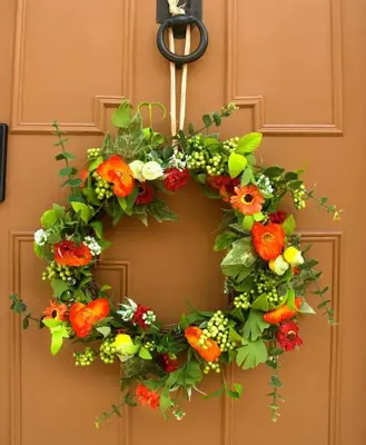 a door with a flower wreath on a door at Huge Deluxe 600 Year Old Essex Manor, Hot Tub, Cinema Room, Sky Tv in Saffron Walden