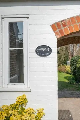 a sign on the side of a house with a window at 3 Bed in Letheringham oc-pclet in Kettleburgh