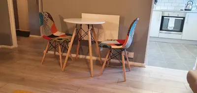 three chairs and a table in a kitchen at The Court in Braintree