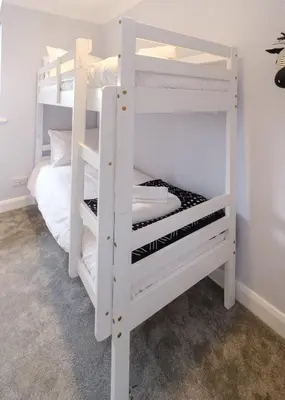 a white bunk bed in a room at 2 Hillcrest - Aldeburgh Coastal Cottages in Leiston