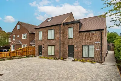 a brick house with a driveway in front of it at Citystay Living - Finch House in Cambridge