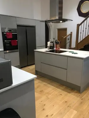 a kitchen with a large island in a room at Beautiful grade II listed 4 bed Victorian Conversion - Billericay Essex in Billericay
