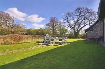 a yard with a table and chairs and a building at Beautiful grade II listed 4 bed Victorian Conversion - Billericay Essex in Billericay