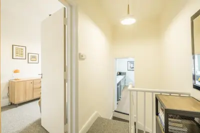 a hallway with a door leading into a room with a kitchen at Fabulous Large Apartment for 7 - CENTRAL Cambridge in Cambridge