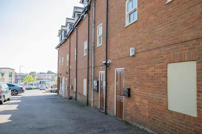 a brick building with a door on the side of it at Velvet 2-bedroom apartment, Brewery Road, Hoddesdon in Hoddesdon