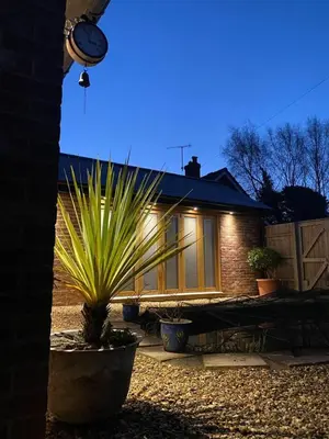 a house with a potted plant in front of it at The Knox - Beautiful Two Bed Cottage Near Orford in Woodbridge