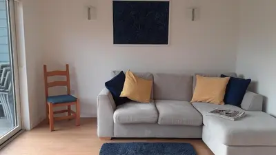 a living room with a couch and a chair at The Annexe, Cornfields in Elmswell