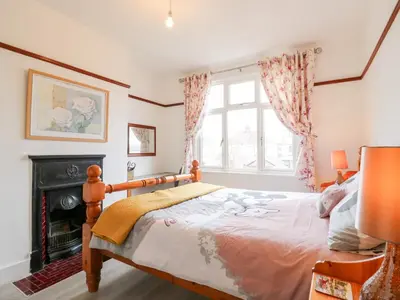 a bedroom with a bed and a fireplace at Ninety Eight in Southend-on-Sea