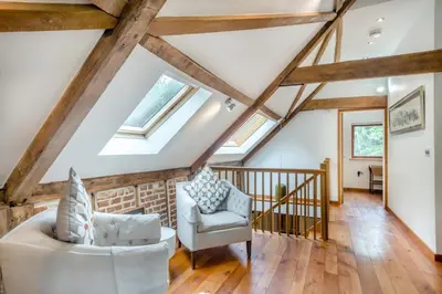 a living room with wooden ceilings and skylights at 3 Bed in Ketteringham oc-1878 in East Carleton
