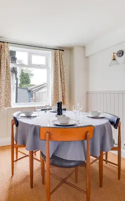 a dining room table with a blue table cloth at 2 Bed in Halesworth oc-7lr in Halesworth