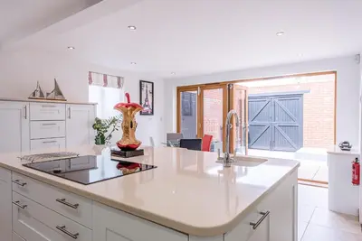 a kitchen with a sink and a counter top at Guild House, Aldeburgh in Aldeburgh