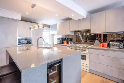 a kitchen with a large island in the middle at The Picture House, Aldeburgh in Aldeburgh
