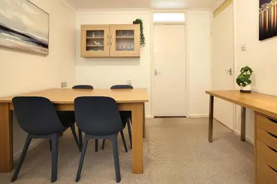 a conference room with a wooden table and chairs at Pass the Keys 1BR Modern Beautiful House Pass the Keys in Cambridge