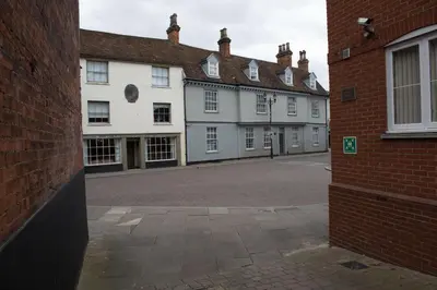 a row of white buildings in a street at Toothbrush Apartments - Central Ipswich - Gipping Mews in Ipswich