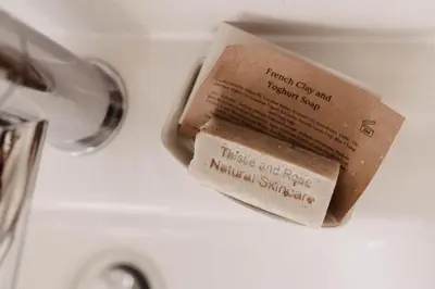 a book is sitting on top of a sink at The Dragonfly Shepherds Hut in Colchester