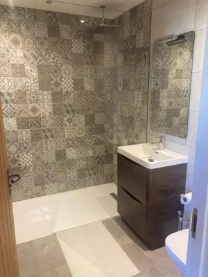 a bathroom with a sink and a mirror at The Oaks Stable cottage in Haughley