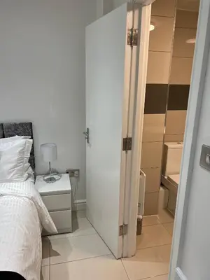 a bedroom with a bed and a closet at Lovely holiday home in Southminster in Southminster