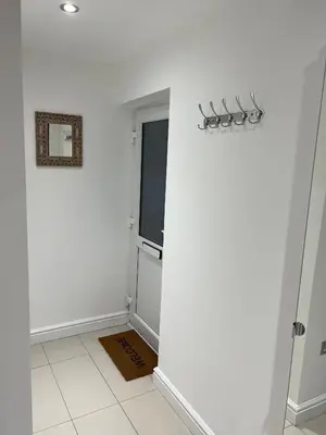 a room with a white wall and a window at Lovely holiday home in Southminster in Southminster